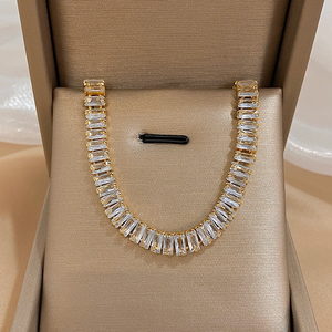 Gold and diamond necklace in a jewelry box