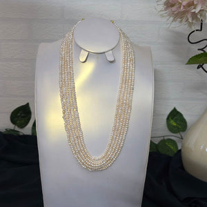 Decorative wall light fixture with crystal accents on a white background