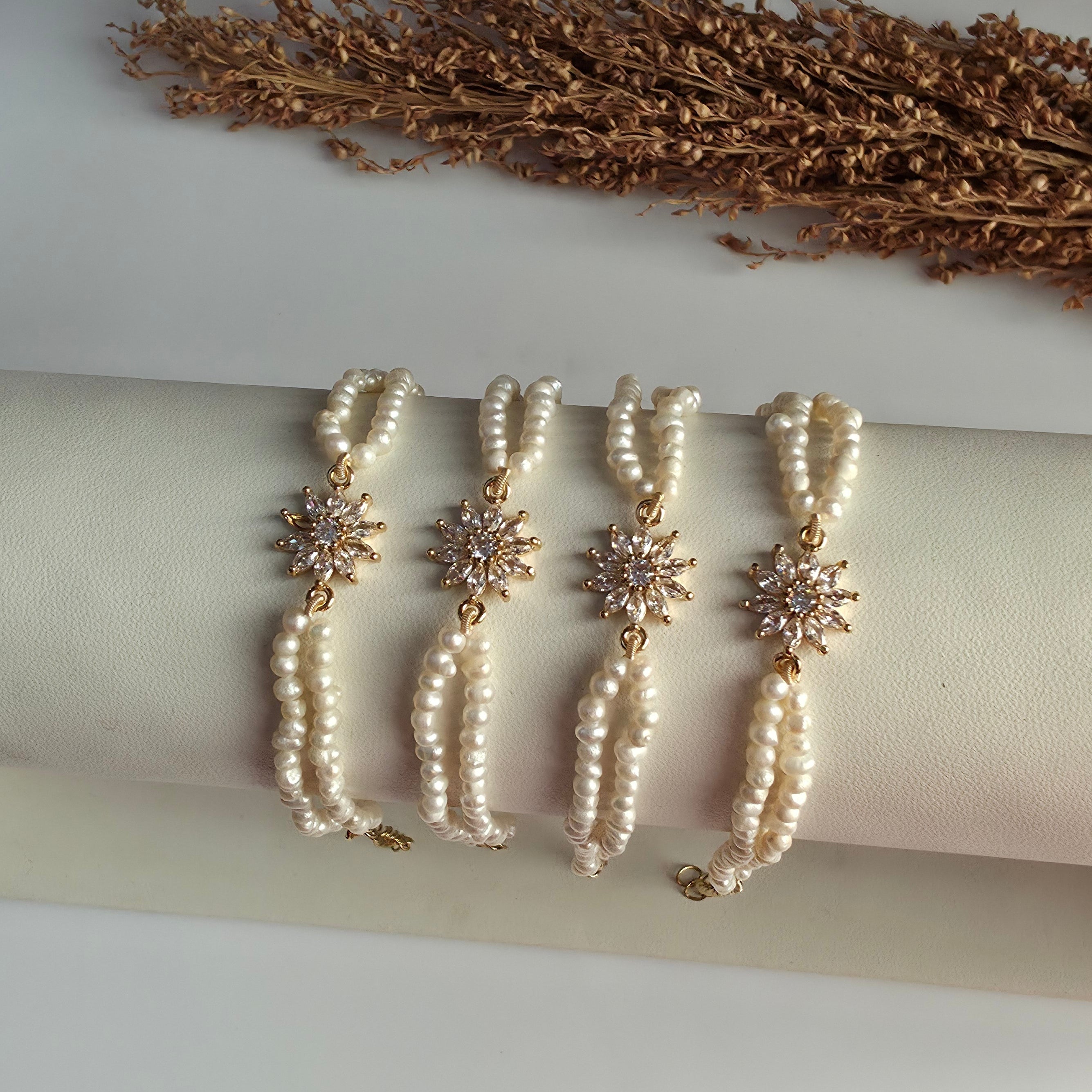 Genuine freshwater pearl bracelet with gold floral centerpiece