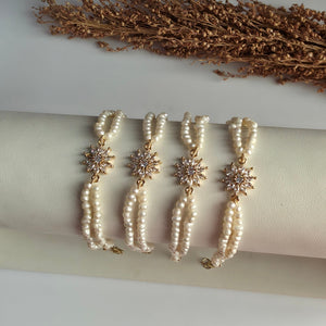 Genuine freshwater pearl bracelet with gold floral centerpiece