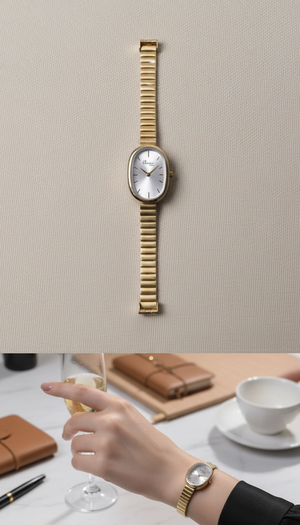 Gold watch on wrist with a neutral background