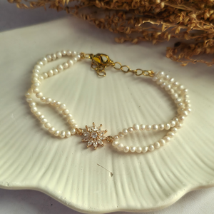 Genuine freshwater pearl bracelet with gold floral centerpiece