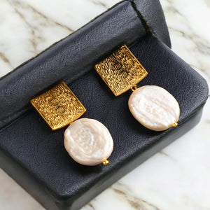 Square Earrings with Baroque Freshwater Pearls displayed on a black jewelry box."
