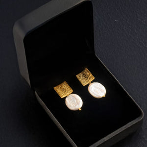 Square Earrings with Baroque Freshwater Pearls displayed on a black jewelry box."