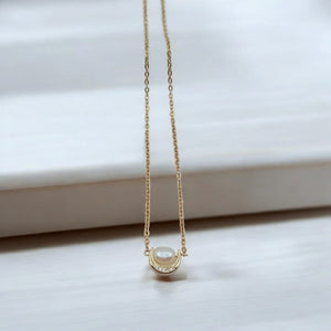 18K Gold-Plated Crescent Moon Necklace with Freshwater Pearl displayed on a minimalist background.