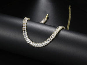 Silver bracelet with baguette-cut stones on a black satin surface