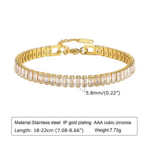 Gold bracelet with clear stones on a white background