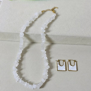 Embroidered design on a fabric with a brand logo in the background