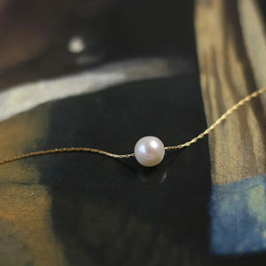 Elegant freshwater pearl pendant necklace with 18K gold-plated chain by Urban Gear displayed on neutral background