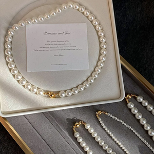 Magnetic White Pearl Necklace with European and American style, featuring elegant white pearls and a secure magnetic clasp, perfect for personalized fashion