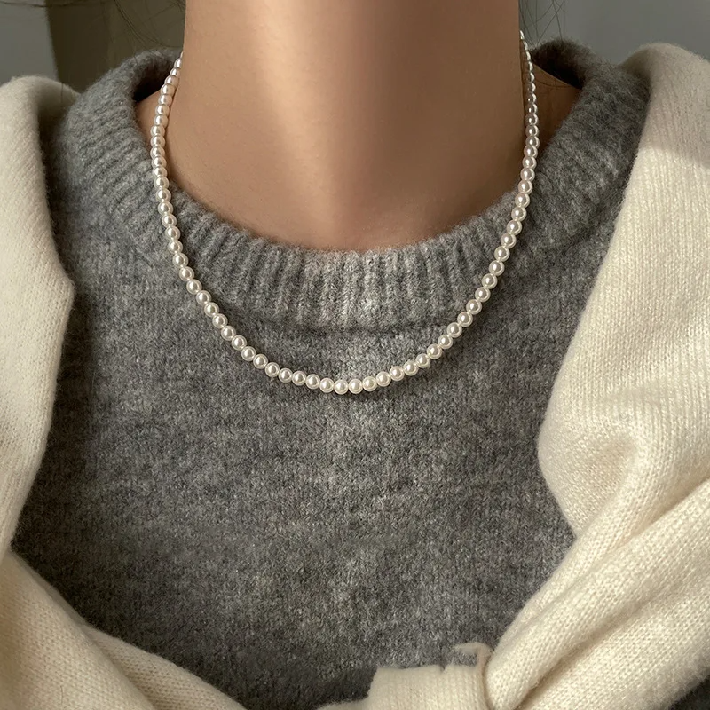 Magnetic White Pearl Necklace with European and American style, featuring elegant white pearls and a secure magnetic clasp, perfect for personalized fashion