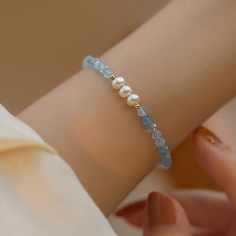 "Handmade Aquamarine and Freshwater Pearl bracelet with gold-plated details by Urban Gear"

