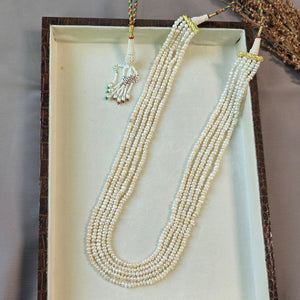 Handcrafted multi-strand freshwater pearl mala necklace with adjustable dori displayed in a jewelry box