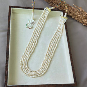 Handcrafted multi-strand freshwater pearl mala necklace with adjustable dori displayed in a jewelry box