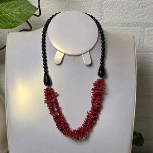 Red coral and black onyx handmade necklace close-up