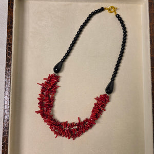 Red coral and black onyx handmade necklace close-up