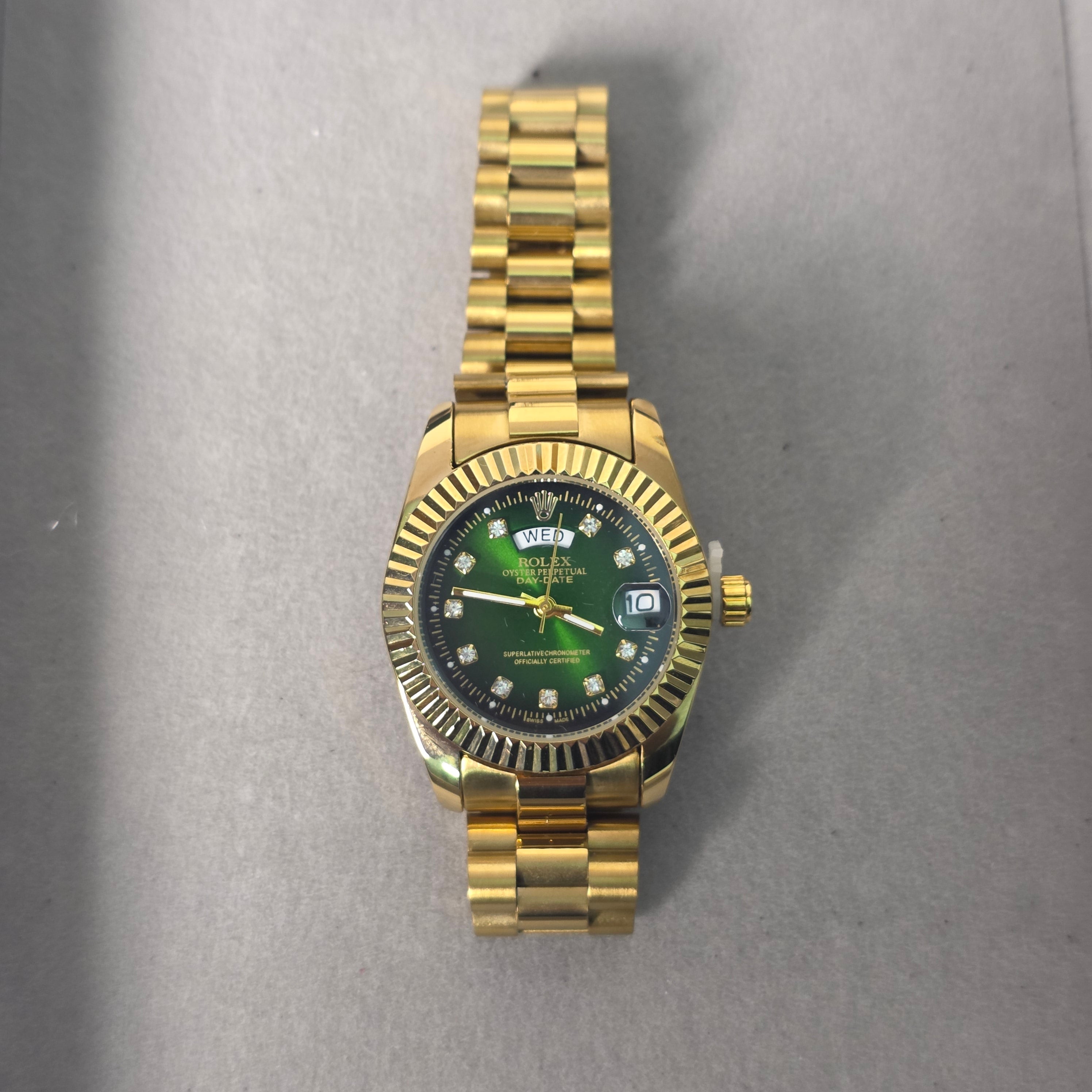 green dial gold watch women
