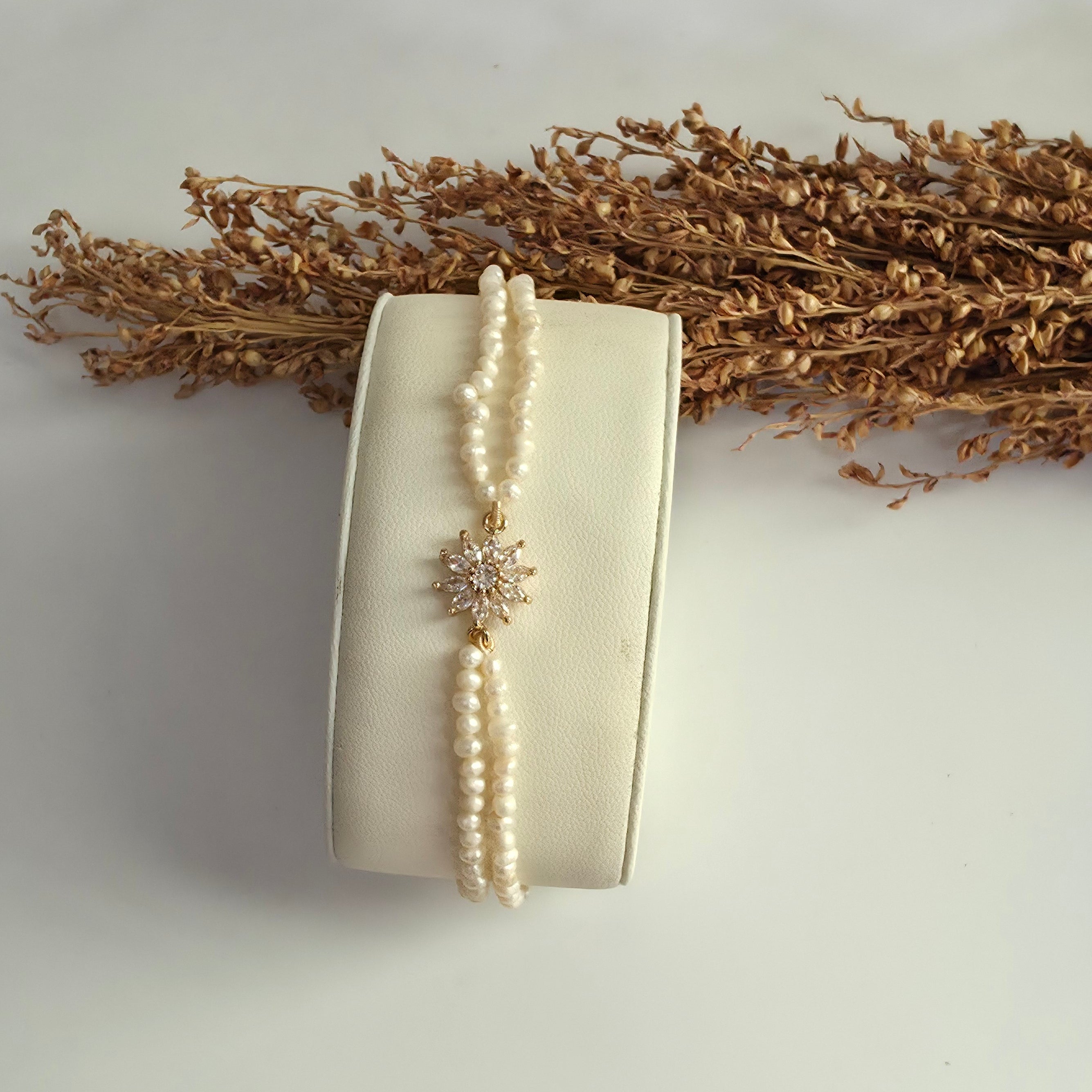 Genuine freshwater pearl bracelet with gold floral centerpiece