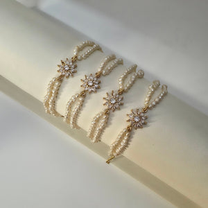 Genuine freshwater pearl bracelet with gold floral centerpiece