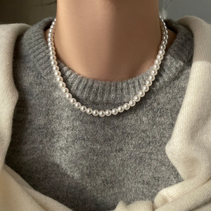 Magnetic White Pearl Necklace with European and American style, featuring elegant white pearls and a secure magnetic clasp, perfect for personalized fashion