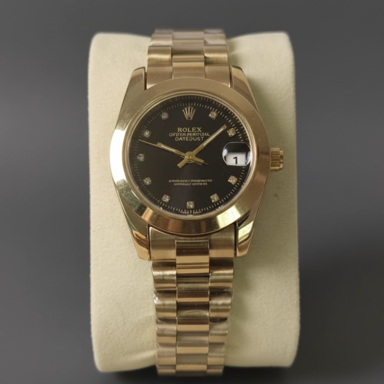Gold wristwatch with black dial on a gray background