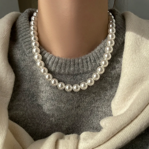 Magnetic White Pearl Necklace with European and American style, featuring elegant white pearls and a secure magnetic clasp, perfect for personalized fashion