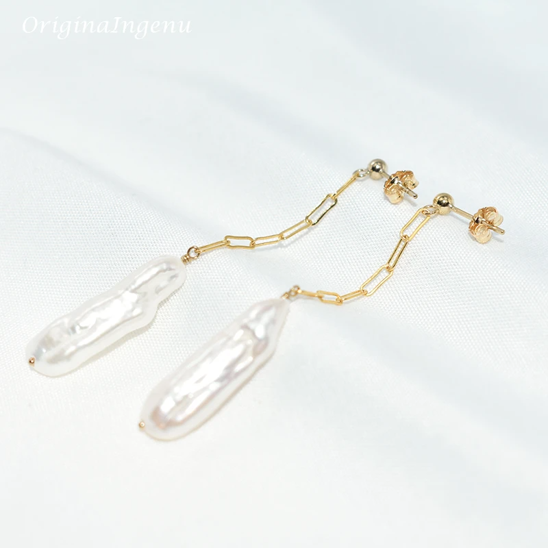 Gold chain earrings with clear teardrop-shaped pendants on a white background