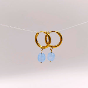 Handcrafted aquamarine stone necklace and gold hoop earrings set with adjustable gold chain.