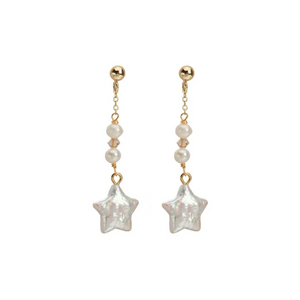 Gold-plated star-shaped freshwater pearl drop earrings by Urban Gear UG on brown fabric background

