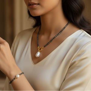 Black Freshwater Pearl Necklace with White Baroque Pendant & Gold-Plated Accents
