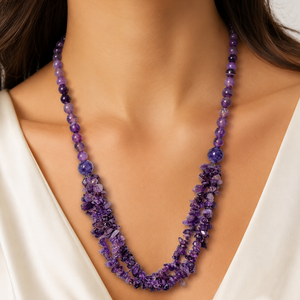 Purple beaded necklace worn by a model against a white background