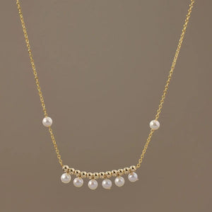 Elevate your style with our Elegant Pearl Drop Necklace, featuring a delicate gold-plated chain adorned with lustrous pearls