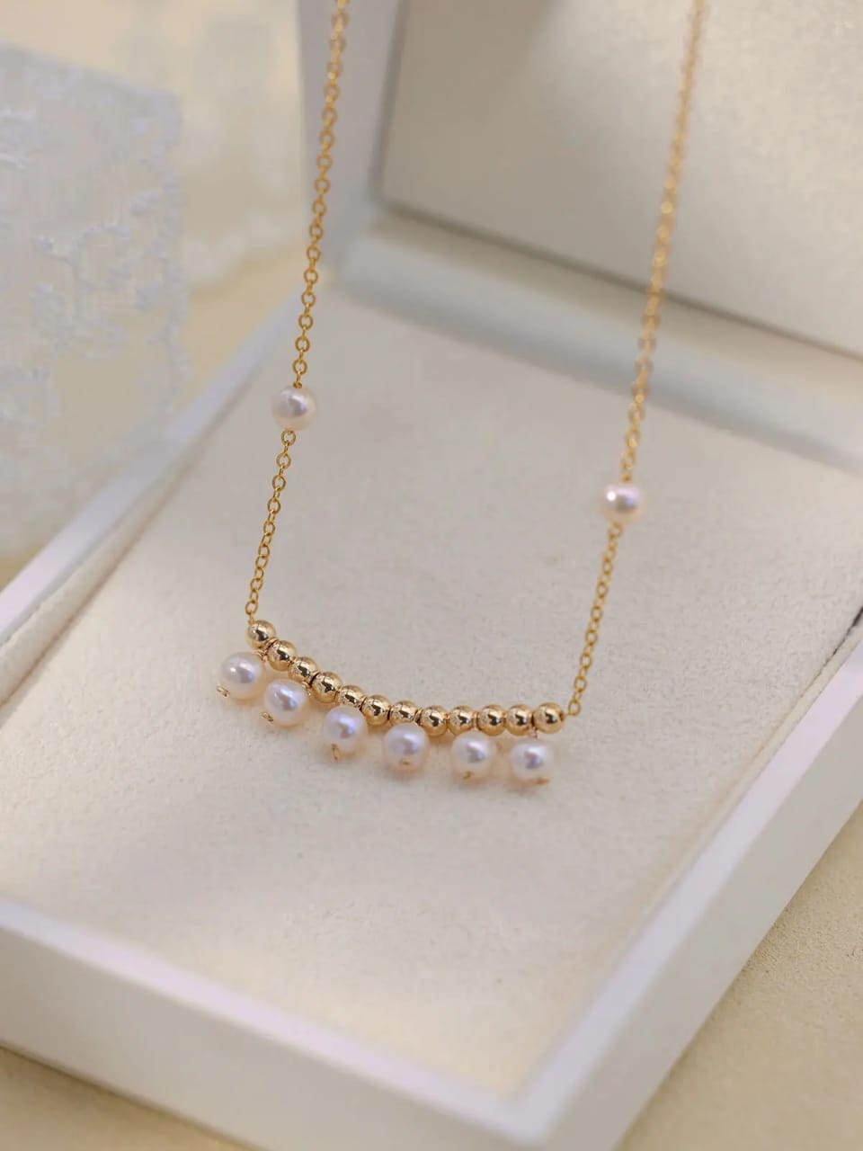 Elevate your style with our Elegant Pearl Drop Necklace, featuring a delicate gold-plated chain adorned with lustrous pearls