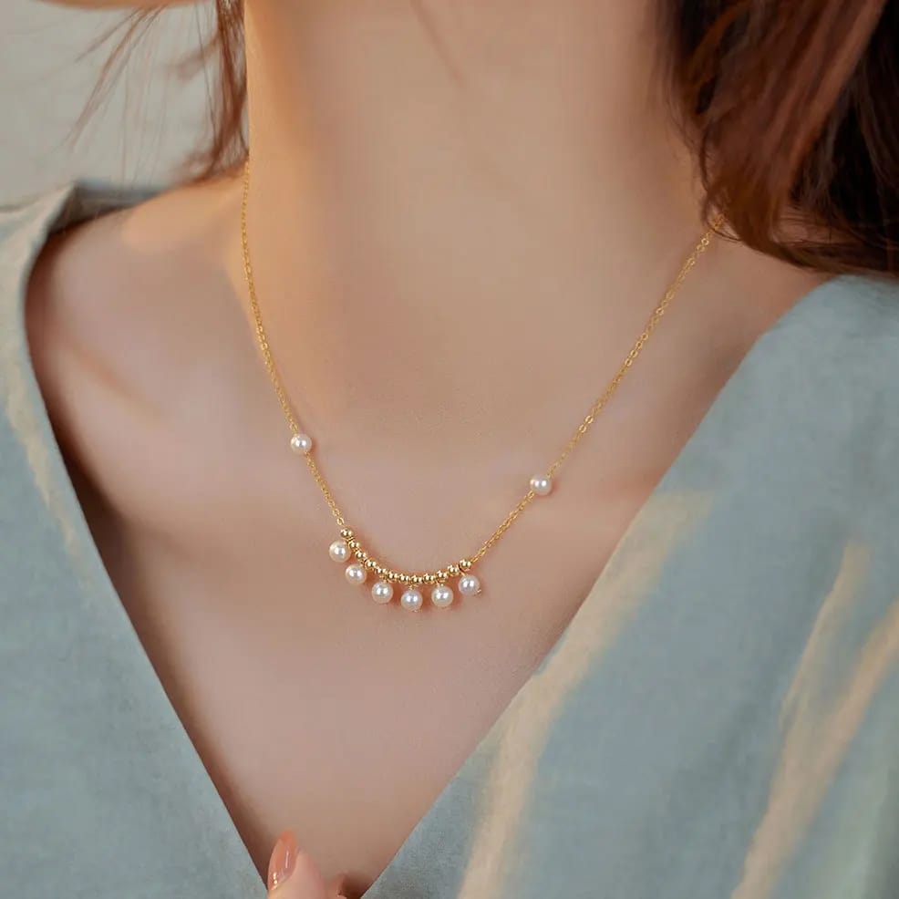 Elevate your style with our Elegant Pearl Drop Necklace, featuring a delicate gold-plated chain adorned with lustrous pearls