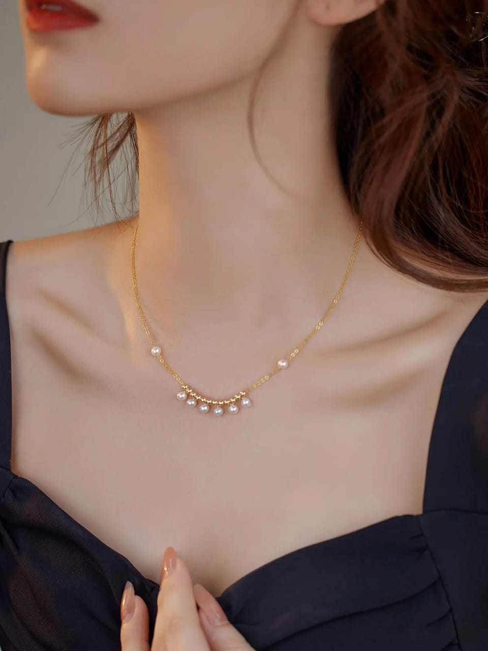 Elevate your style with our Elegant Pearl Drop Necklace, featuring a delicate gold-plated chain adorned with lustrous pearls