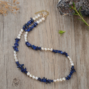 "Handmade necklace with freshwater pearls and gemstones including black obsidian, turquoise, amethyst, and lapis lazuli"