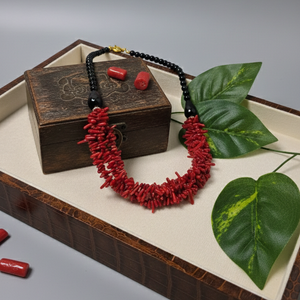 Red coral and black onyx handmade necklace close-up