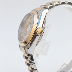Close-up of a silver and gold watch on a white background