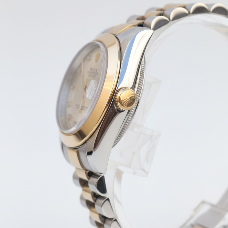 Close-up of a silver and gold watch on a white background