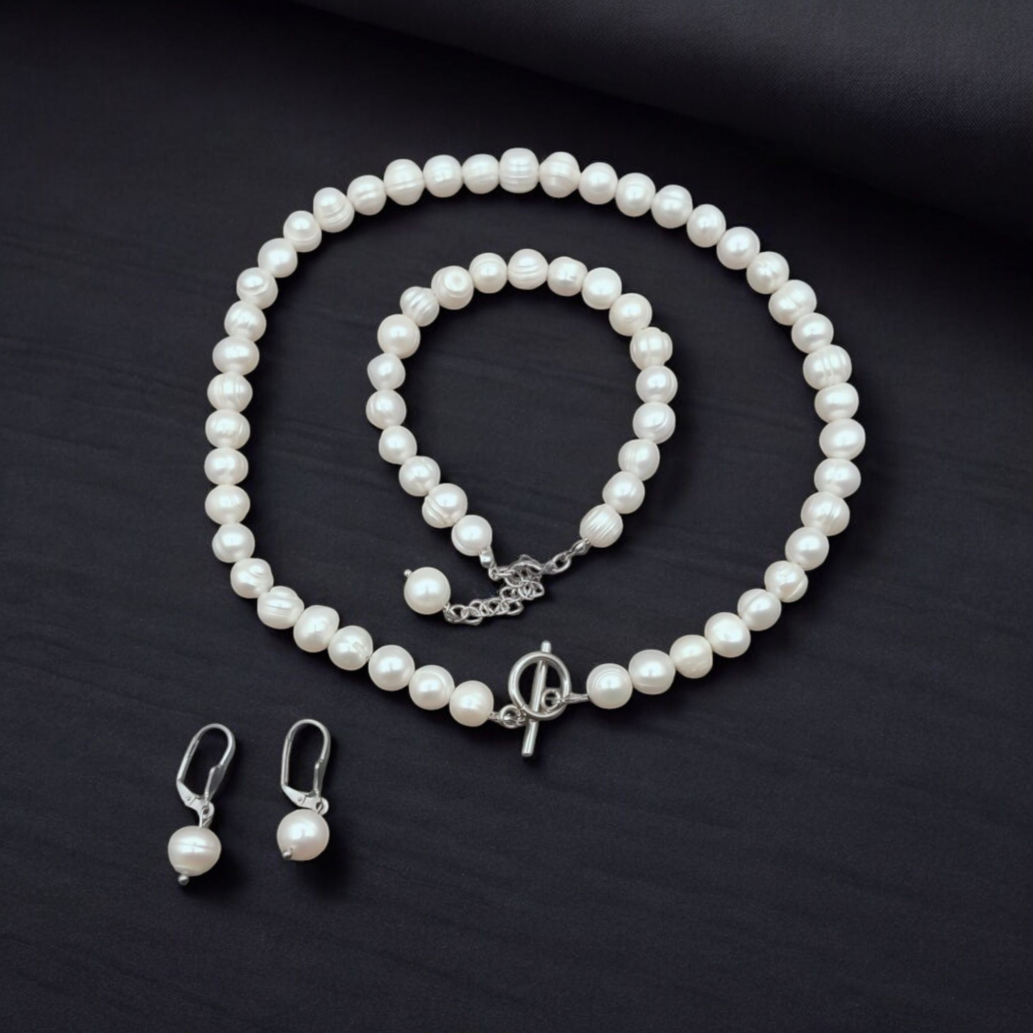 Freshwater pearl necklace set," "Elegant pearl bracelet," and "Luxury pearl earrings