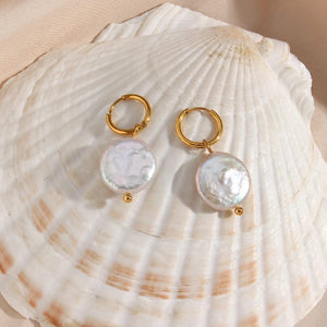 Minimalist freshwater pearl hoop earrings featuring a sleek gold-plated design