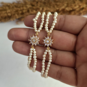 Genuine freshwater pearl bracelet with gold floral centerpiece