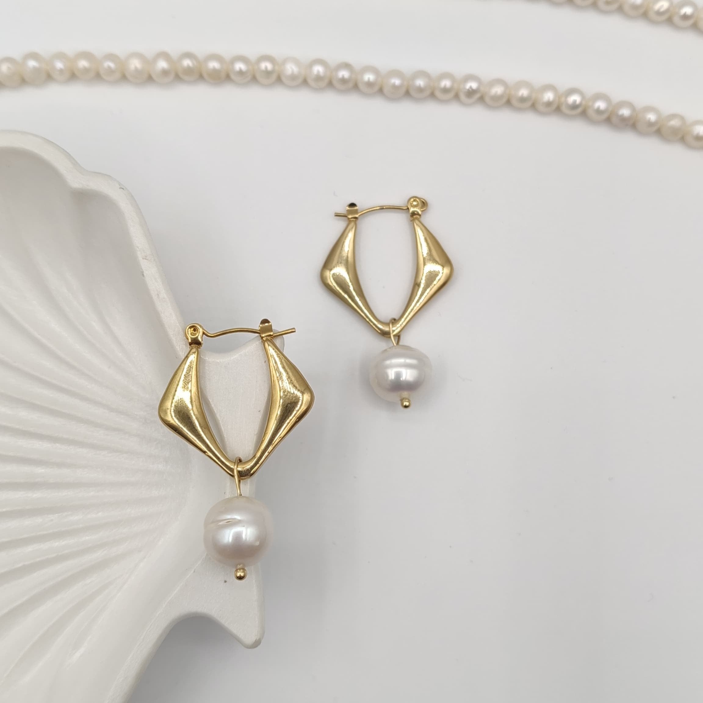 Gold-Plated Freshwater Pearl Drop Earrings with Modern Twist Design