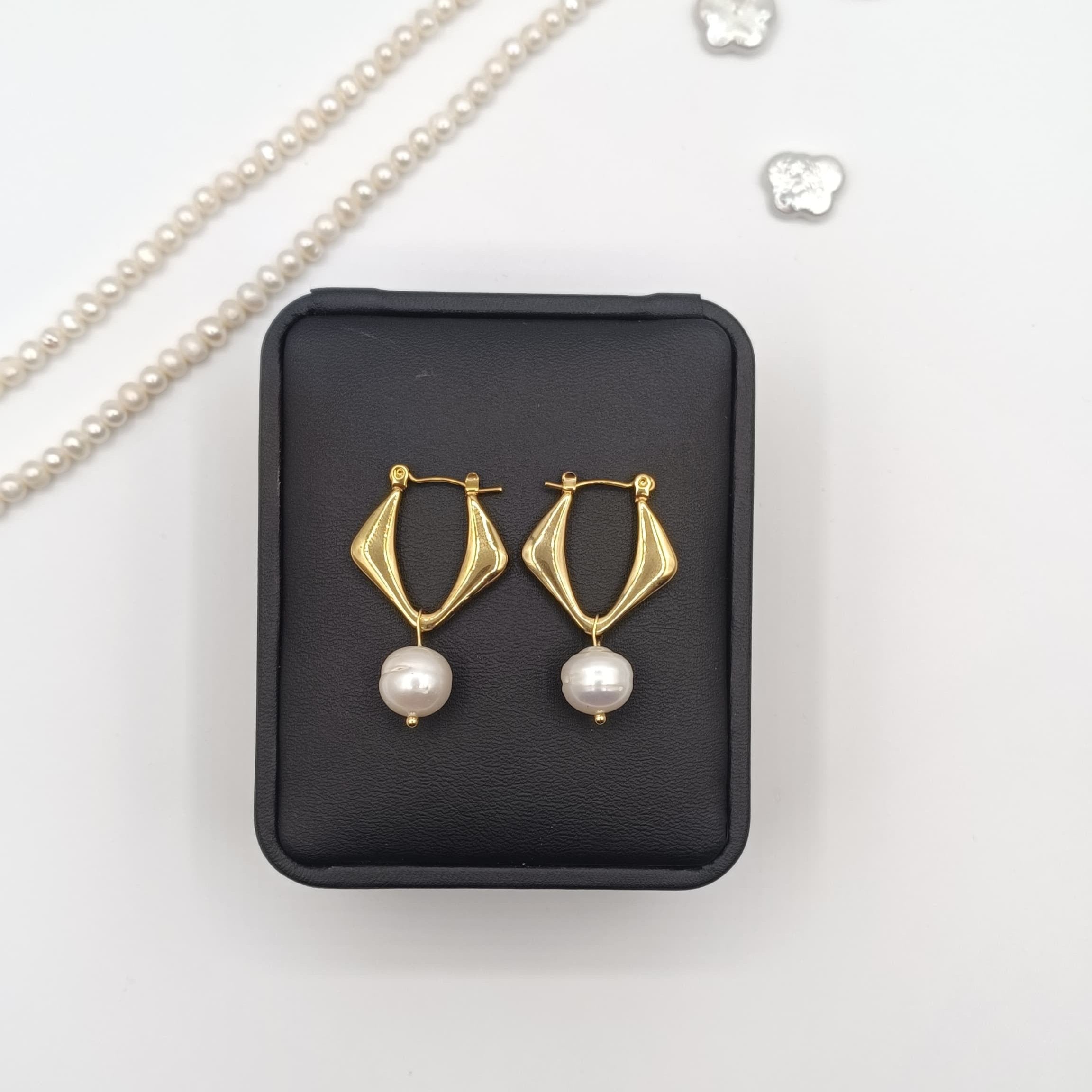 Gold-Plated Freshwater Pearl Drop Earrings with Modern Twist Design