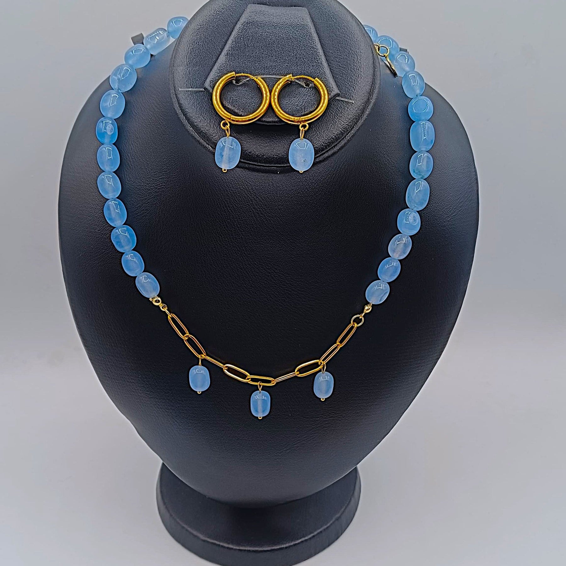 Handcrafted aquamarine stone necklace and gold hoop earrings set with adjustable gold chain