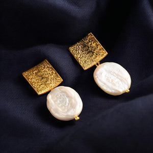 Square Earrings with Baroque Freshwater Pearls displayed on a black jewelry box."

