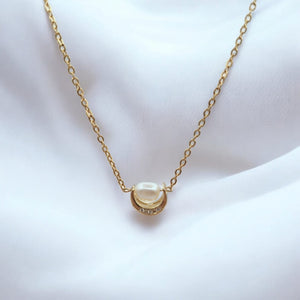 18K Gold-Plated Crescent Moon Necklace with Freshwater Pearl displayed on a minimalist background.