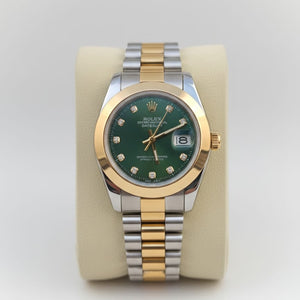 Two-tone watch with a green face on a white background