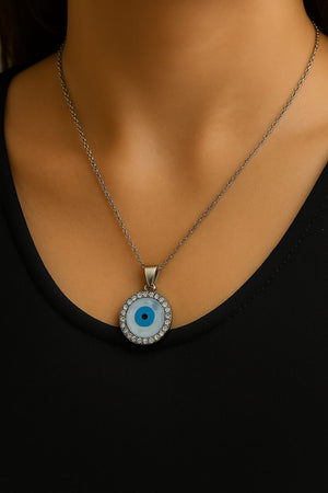 Necklace with a blue eye pendant on a black background