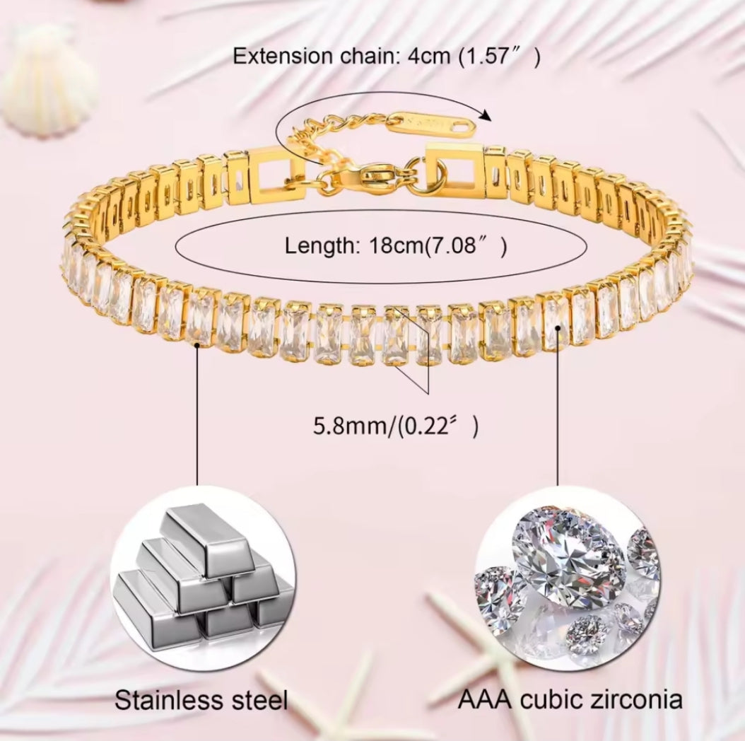 Gold bracelet with cubic zirconia stones on a pink background